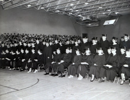 Commencement 1960: View of Graduates, First Row Sitting Second Row Standing