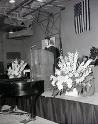 Commencement 1960: View of Flowers, Stage, and Speaker