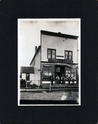 Men Standing in Front of Lawrence J. Maloney's Variety Store