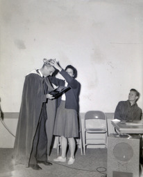 APO Ugly Man Contest--Winner: Stan Albeck, Students: Ray Clemo and Jay Holman 1961: Woman Crowning Winner Stan Albeck