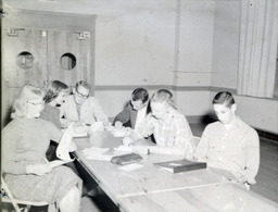 Unknown--Students at a Desk: Six Students Sitting at Desk, Working on Homework