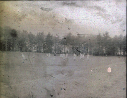 Football ca. 1960: Blurry Distance Photo of Playing