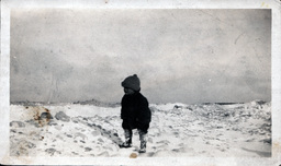 Young Boy on Frozen Lakeshore