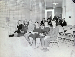 West Hall Dedication Fall 1960: Four Women, Two Men Sitting in Front Row