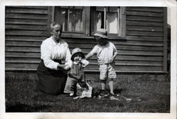 Older Woman with Dog and Children