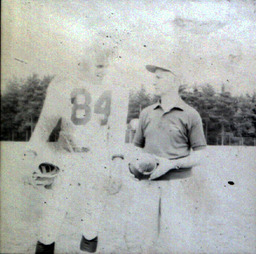 Coach Ferzacca ca. 1960: Coach Ferzacca Standing with Player #84