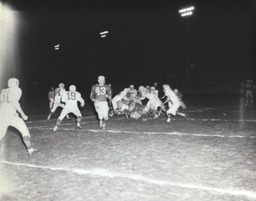 Intrasquad Football Game Spring Practice--Outstanding Back: Mike Strebel, Outstanding Lineman: Wayne Sickler 1961: Players Making A Tackle