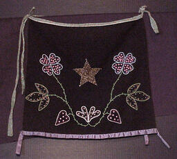 Beaded apron with bird motif