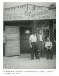 Three Men with Nazi Banner at Buchenwald