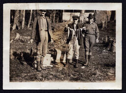 Three Men Displaying Fish