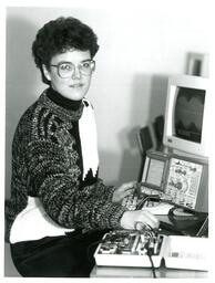 Student Using Oscilloscope and Early Computer (Part of the NMU Historic Photographs Collection)