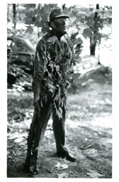 Man in Forest Camouflage Carrying Gun (Part of the NMU Historic Photographs Collection)