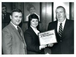 Northern Michigan University Receiving Certificate of Recognition (Part of the NMU Historic Photographs Collection)