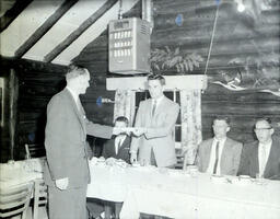 (134-02) APO Awards Dinner 1960: A Man Passes Another Man a Note