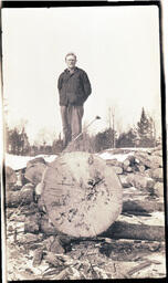 Man on Large Trunk