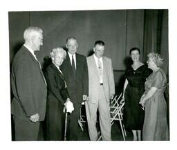 Group of People Standing in a Semicircle and Talking (Part of the NMU Historic Photographs Collection)