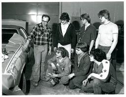 Professor Showing A Group of Students Car Paint (Part of the NMU Historic Photographs Collection)