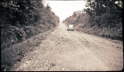 (024-011) Car Driving Along Dirt Section of M-64