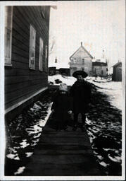 Two Davidson Children on Wooden Walkway