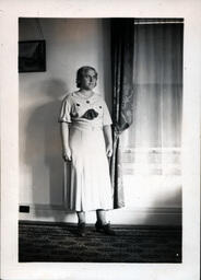 Woman Standing Near Window