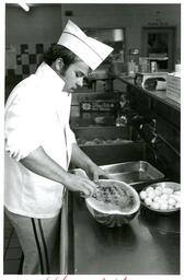 Culinary Student Using Melon Baller (Part of the NMU Historic Photographs Collection)