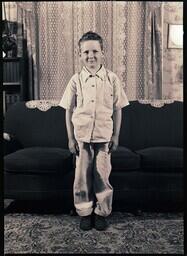 (048-003) Chabot Boy Standing in Front of Couch (1 of 2)