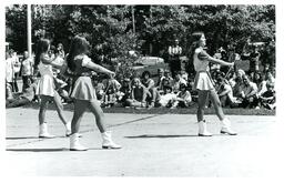 Baton Twirlers Performing on Sidewalk (Part of the NMU Historic Photographs Collection)