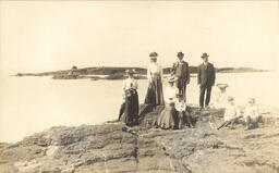 People on rock shoreline of Lake Superior (2 of 3)