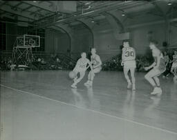 Basketball 1959-1960: Northern Player Dribbling Down Court