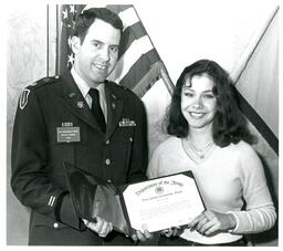 Benjamin M. Davis Giving a Scholarship to Female Student (Part of the NMU Historic Photographs Collection)