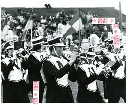 Trumpet Players Performing in Marching Band (Part of the NMU Historic Photographs Collection)