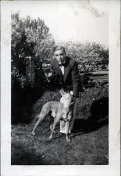 Tom Ross in Suit with Dog