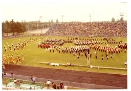 Several Different Marching Bands Performing on Football Field (Part of the NMU Historic Photographs Collection)