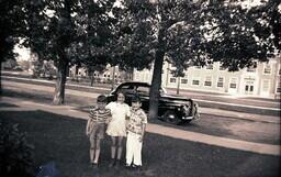 (007-019) Three Children Posing on Lawn in front of Car