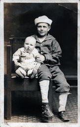 Boy in Sailor Cap with Baby