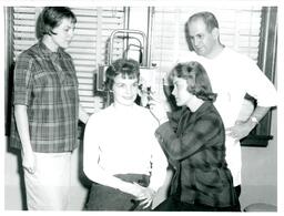 Students and Professor Giving an Ear Exam (Part of the NMU Historic Photographs Collection)