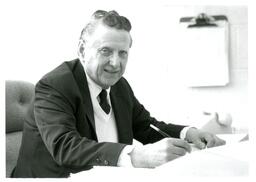 Man Writing at Desk (Part of the NMU Historic Photographs Collection)