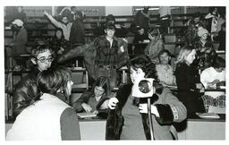 Professor Speaking to Student after Class (Part of the NMU Historic Photographs Collection)