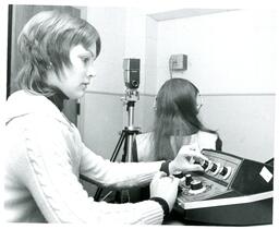 Student Twists Knobs on Equipment (Part of the NMU Historic Photographs Collection)