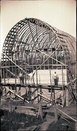 (008-018) Men Standing on Scaffolding Outside Building