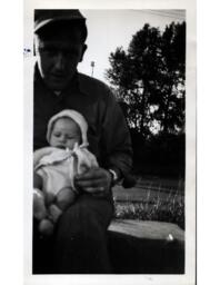 Man Holding Robert Davidson III at One Month