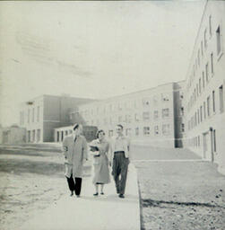 Former Campus Scenes: Two Men and a Woman Walking