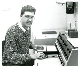 Student Working with Electronic Machine (Part of the NMU Historic Photographs Collection)