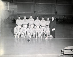 NMC Alumni Basketball 1960-61: Twelve Basketball Players Posing in Group Photo on Court