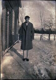 (132-013) Man in Bowler Hat Standing in Snow