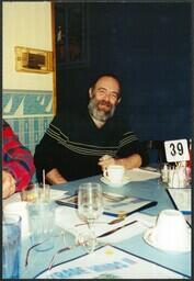 Unknown Man at Restaurant Table