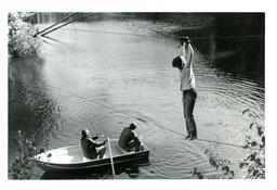 Person on Tightrope above Two People in Rowboat (Part of the NMU Historic Photographs Collection)