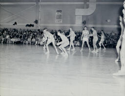 (128-04) Basketball NMC vs. Michigan Tech Feb. 24, 1960: Northern Player Looking to Pass