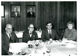 John X. Jamrich and Three Unknown People Sitting at Dinner Table (Part of the NMU Historic Photographs Collection)