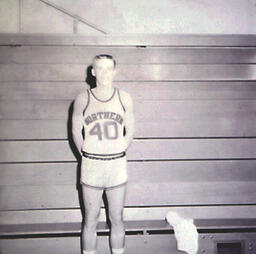 NMC Basketball--Individual Pictures 1960-61: Basketball Player No. 40 Posing for Photo